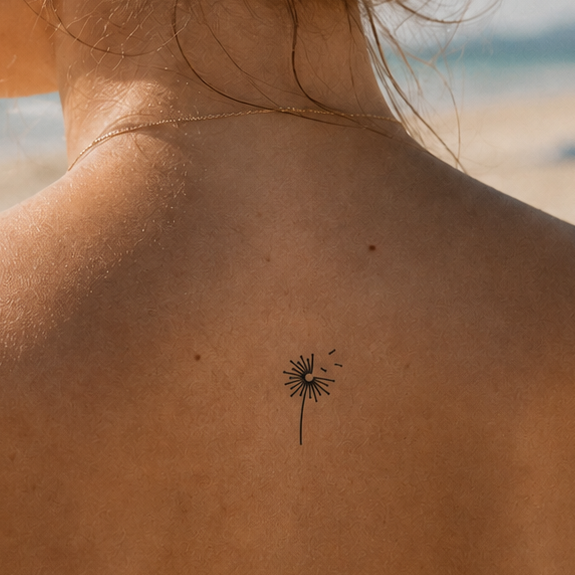 Pusteblume mit fliegenden Samen Tattoo von minink, der Marke für temporäre Tattoos.