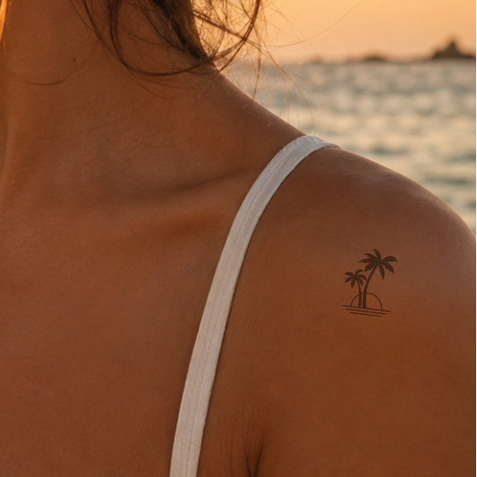 Retro Sonnenuntergang mit Palmen Tattoo von minink, der Marke für temporäre Tattoos.