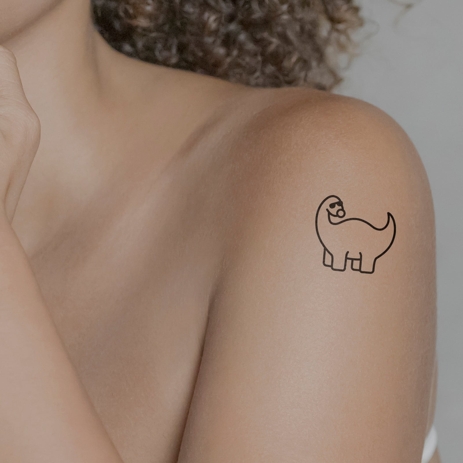 Temporäres Tattoo von minink: Niedlicher Dinosaurier