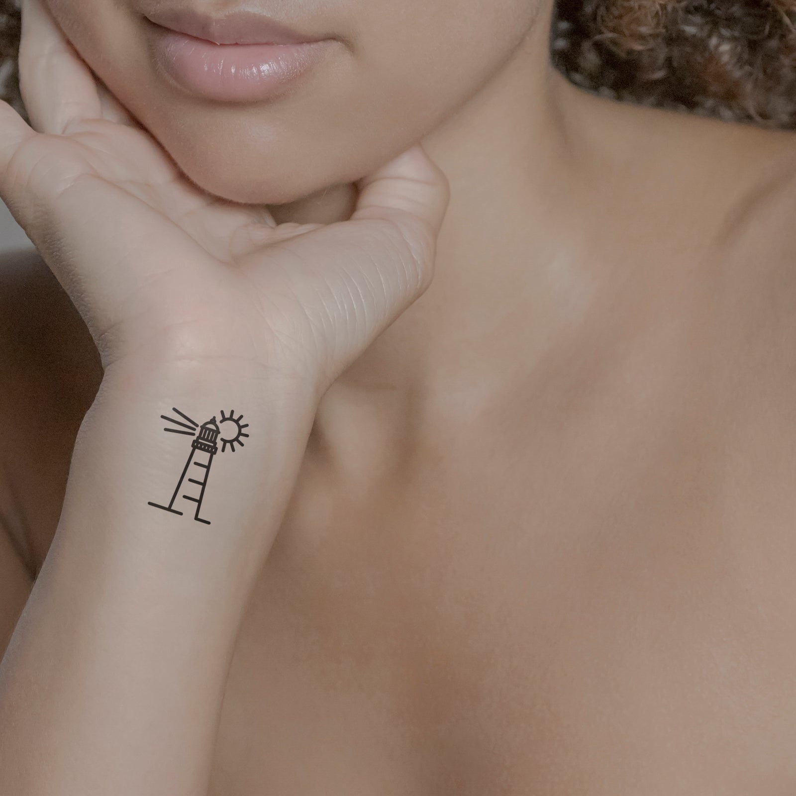 Temporäres Tattoo von minink: Leutchturm mit kleine Sonne