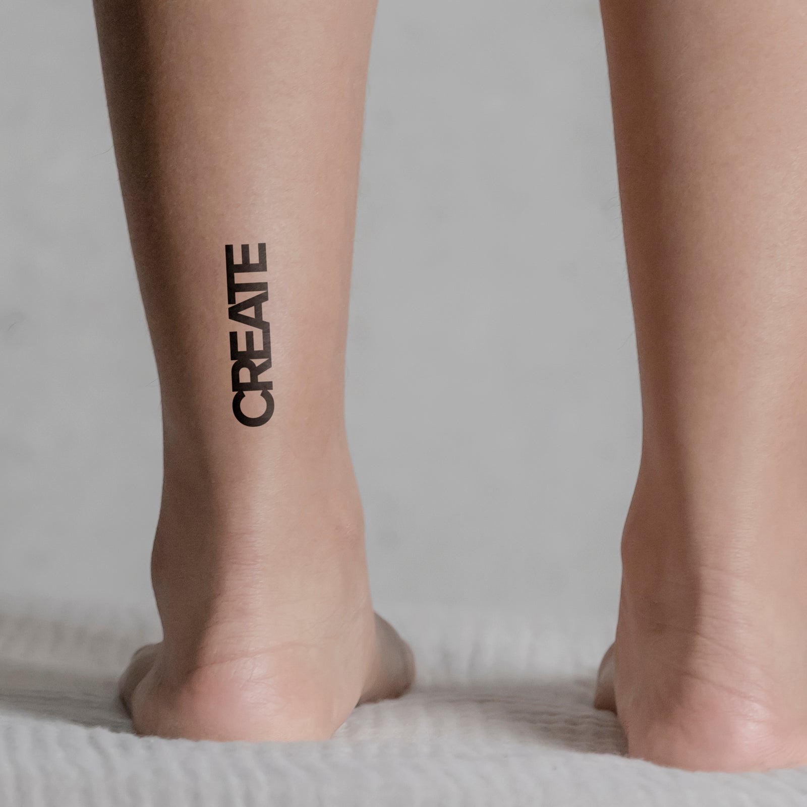 Temporäres Tattoo von minink: CREATE Schriftzug