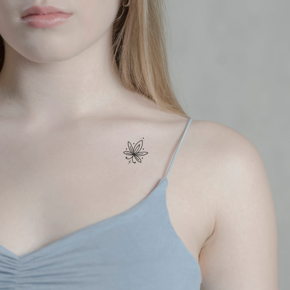 Temporäres Tattoo von minink: Blüte mit Schwung