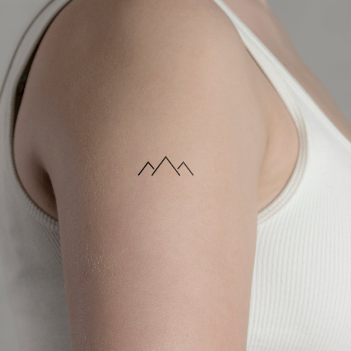 Tiny mountain tattoo on the ankle - Tattoogrid.net