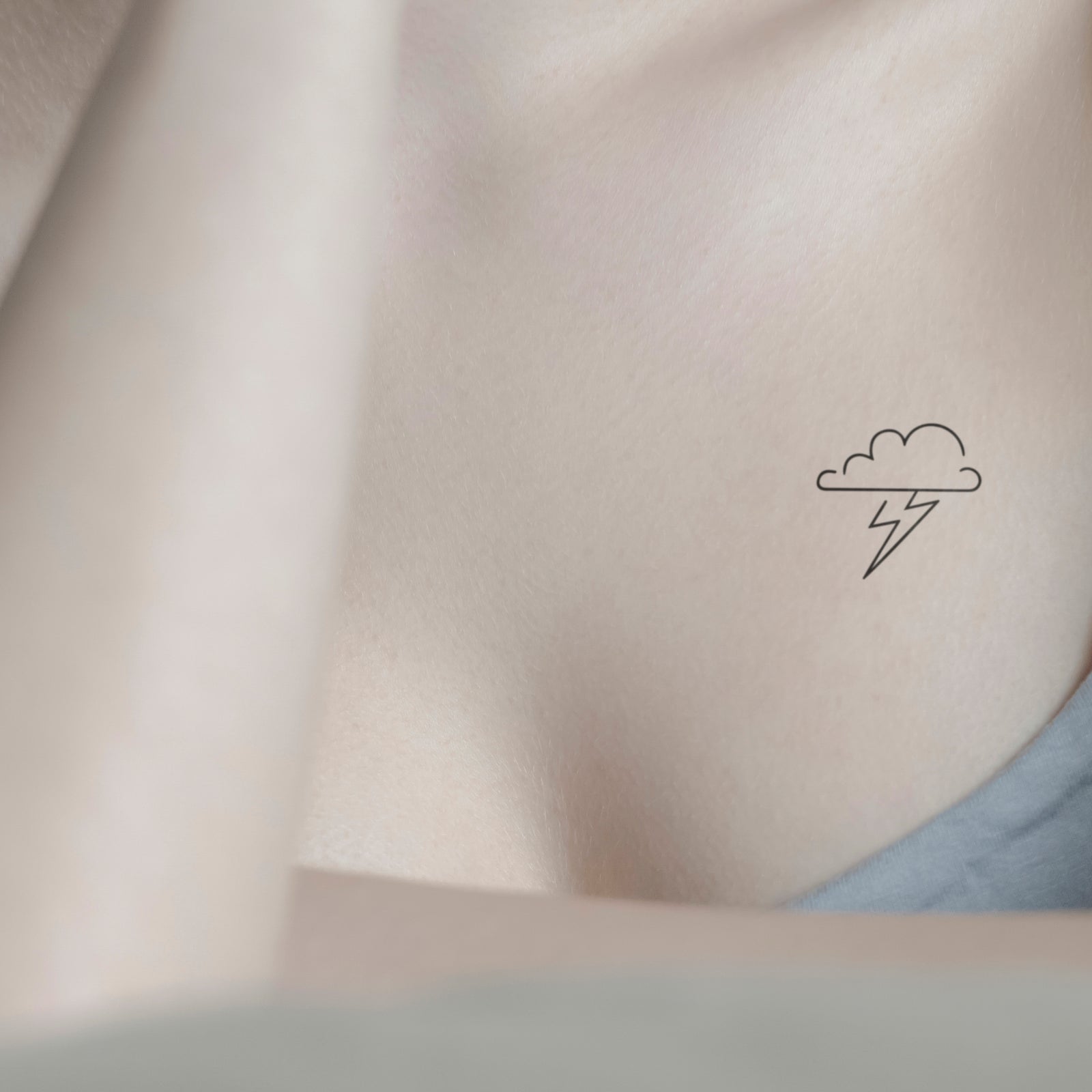 Gewitter Tattoo von minink, der Marke für temporäre Tattoos.