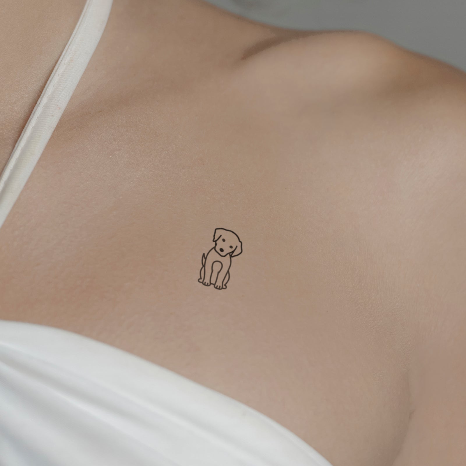 Hund Fineline Tattoo von minink, der Marke für temporäre Tattoos.