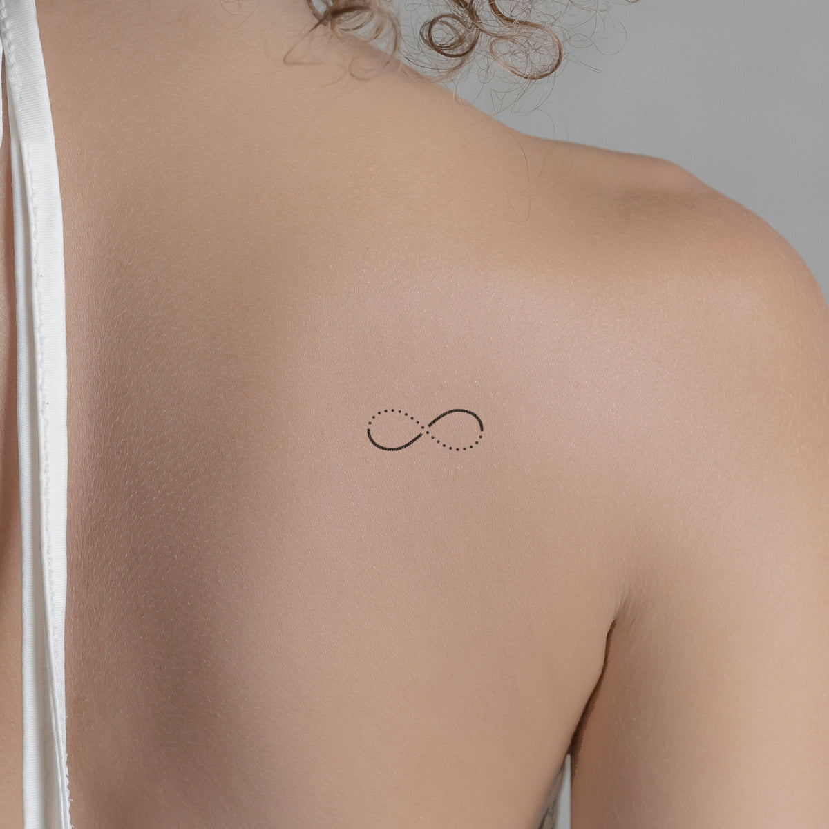 Tattoo in dubai - Small infinity symbol with name initials... | Facebook